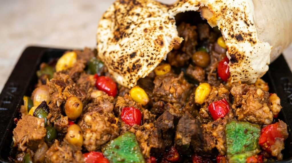 Close-up of tender lamb testi kebab stew at Lalezar