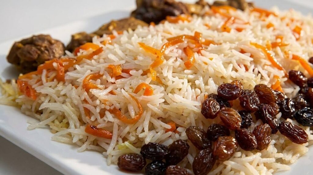 Close-up of kabuli pulao with carrots and raisins