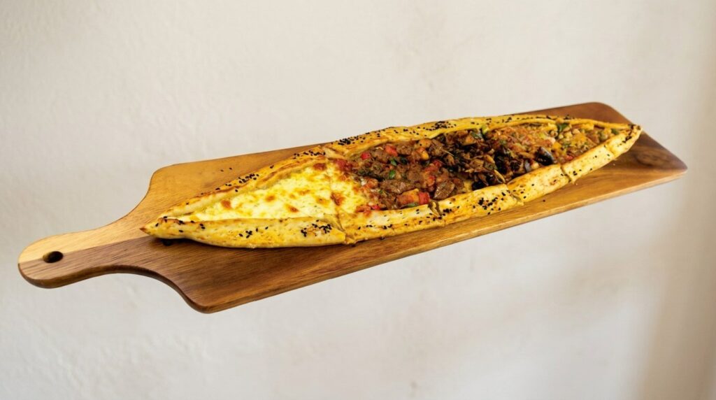 Mixed Turkish pide with cheese and meat